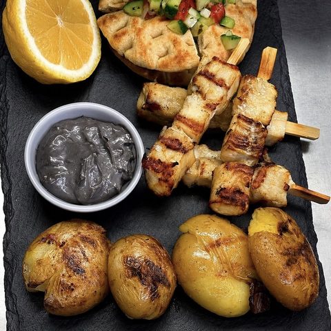 Grilled seafood skewers at Varkoules